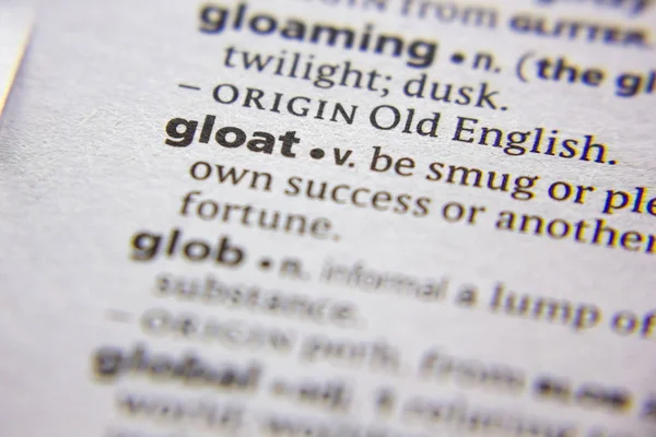 Palabra o frase Gloat en un diccionario . — Foto de Stock