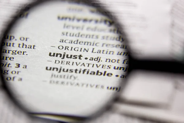 Word or phrase Unjust in a dictionary. — Stock Photo, Image