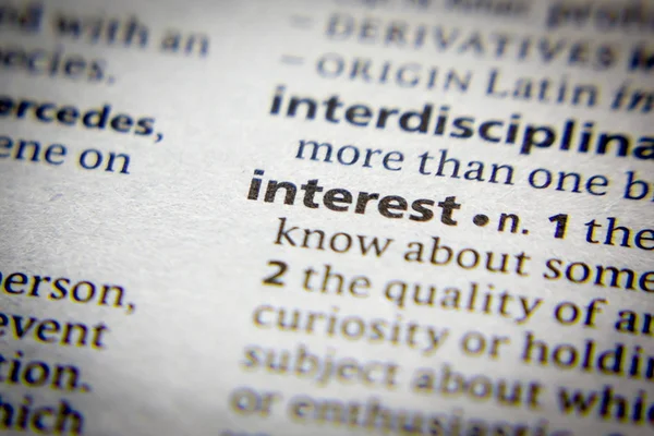 Word or phrase Interest in a dictionary. — Stock Photo, Image