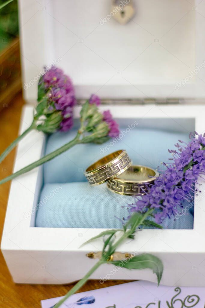 The wedding rings with flowers, marriage concept.