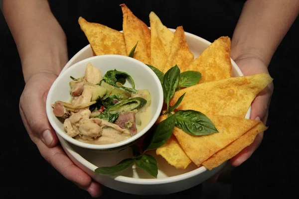 Thai popular recipe,Thai green curry with chicken served with crispy wonton.