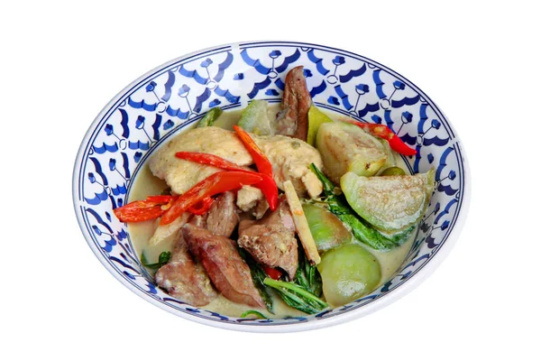 Thai popular recipe, Green chicken curry in coconut milk with eggplant and boiled chicken blood.