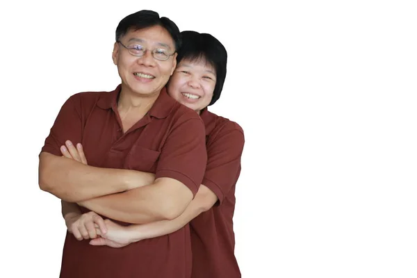 Casal com mais de cinquenta anos em pé, sorrindo e rindo. Abraço — Fotografia de Stock