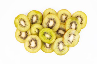 A small pile of freshly sliced kiwis is placed on the top of a white background.