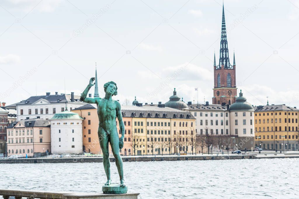 Statue of Carl Eldh Song in front of the town hall, historic centre Gamla Stan and Riddarholmen behind