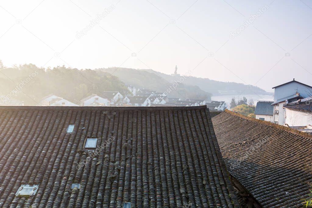Tiles of rooftops of Chinese traditional houses in Mount Putuo, Zhoushan, Zhejiang, China. It is a renowned site in Chinese Buddhism and is the bodhimaa of the bodhisattva Guanyin