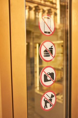Prohibition signs on glass shop entrance doors
