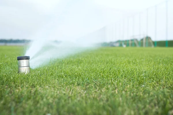 Watering a football field with automatic control