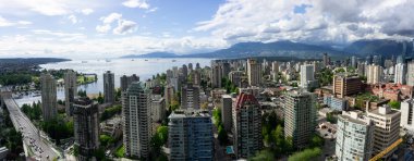 Vancouver, British Columbia, Canada - May 9, 2018: Aerial panoramic view of Downtown City during a sunny day. clipart
