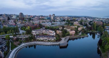 Striking aerial panorama of a beautiful city during a vibrant cloudy sunrise. Taken in False Creek, Downtown Vancouver, British Columbia, Canada. clipart