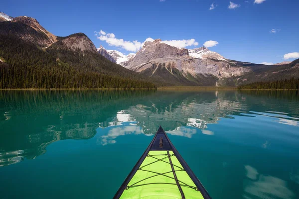 Kayaking in Emerald Lake during a vibrant sunny summer day. Located in British Columbia, Canada.