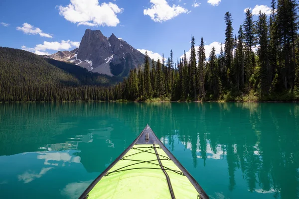 Kayaking in Emerald Lake during a vibrant sunny summer day. Located in British Columbia, Canada.