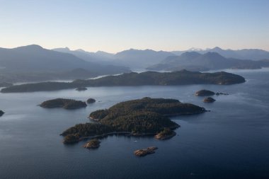 Aerial view of rocky Islands in Howe Sound during a sunny summer evening. Located near Vancouver, BC, Canada. clipart