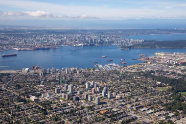 Aerial view of North Vancouver, BC, with Downtown City in the Background. clipart