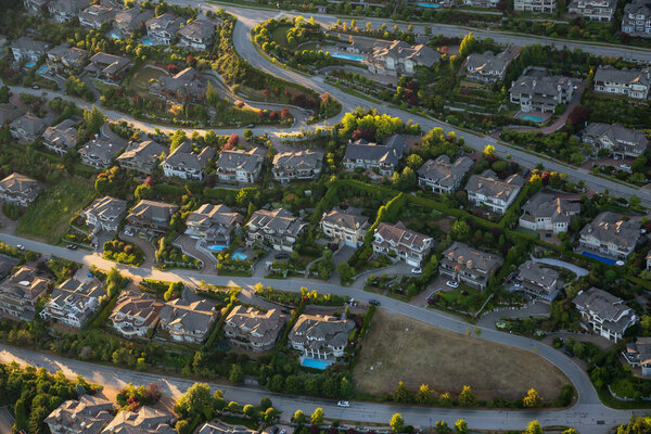 Aerial view of the big luxury homes on the hill during a vibrant sunny summer day. Taken in West Vancouver, British Columbia, Canada.