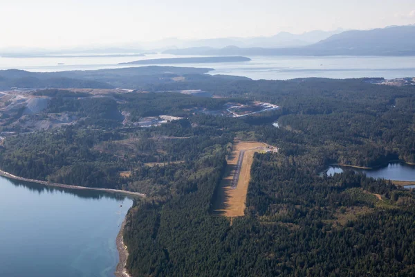 Aerial view of a small Airport on Texada Island, Powell River, Sunshine Coast, BC, Canada.