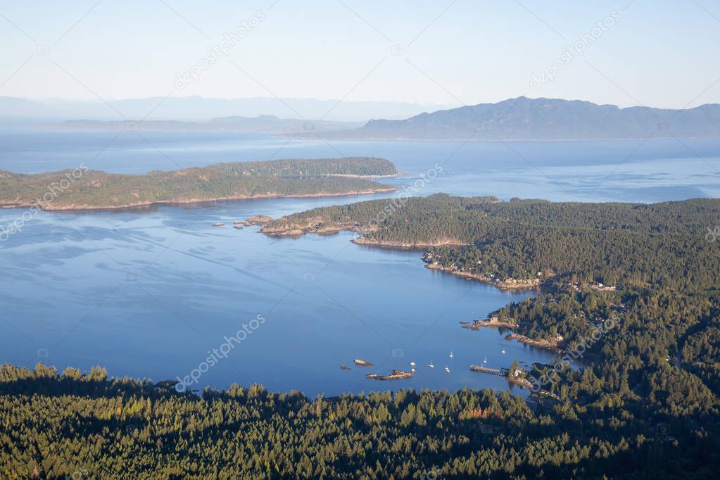 Aerial view of Halfmoon Bay during a sunny summer day. Taken in Sunshine Coast, BC, Canada.
