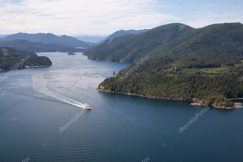 Aerial view of the Ferry traveling between the islands during a sunny summer day. Taken in Sunshine Coast, BC, Canada.