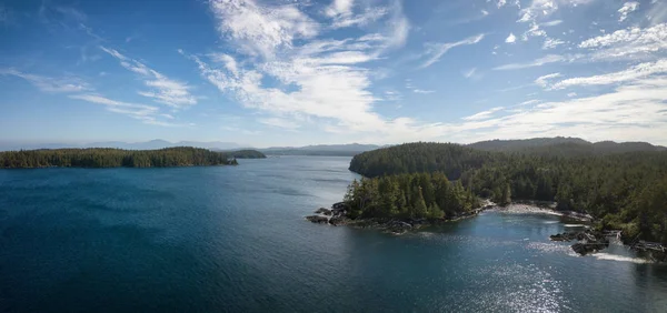 Aerial panoramic landscape of a rocky coast during a vibrant summer day. Taken on the Northern Vancouver Island, British Columbia, Canada.