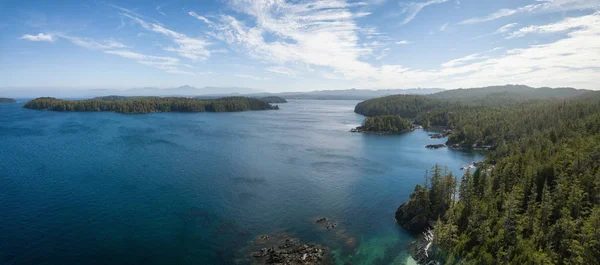 Aerial panoramic landscape of a rocky coast during a vibrant summer day. Taken on the Northern Vancouver Island, British Columbia, Canada.