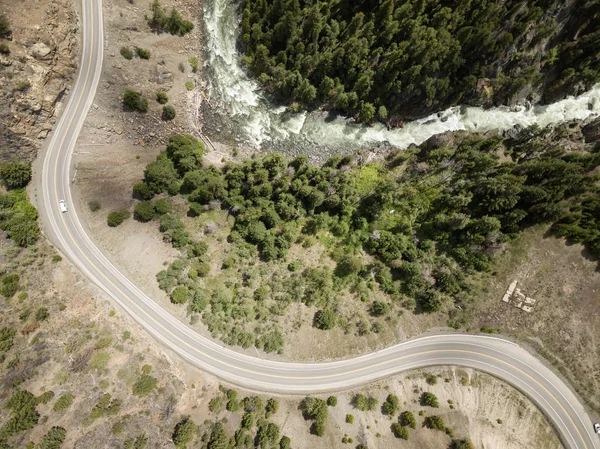 Aerial view from above of a windy road in the valley during a sunny summer day. Taken near Hope, BC, Canada.