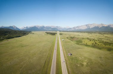 Aerial view of Trans-Canada Highway during a vibrant sunny summer day. Taken near Calgary, Alberta, Canada. clipart