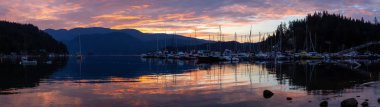 Beautiful panoramic view of Deep Cove during a colorful summer sunrise. Taken in North Vancouver, BC, Canada. clipart