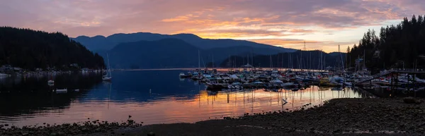 Beautiful panoramic view of Deep Cove during a colorful summer sunrise. Taken in North Vancouver, BC, Canada.