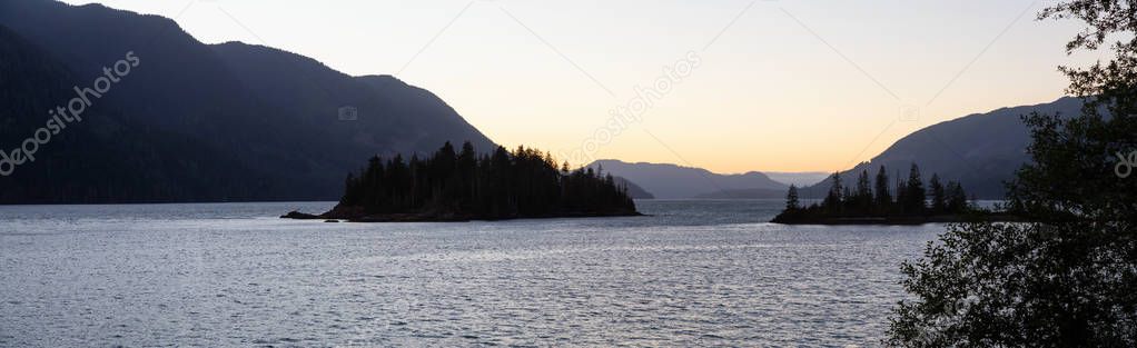 Panoramic landscape view of a beautiful Pacific Ocean Inlet during a vibrant summer sunset. Taken near Port Alice, Northern Vancouver Island, BC, Canada.