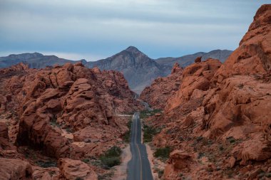 Aerial view on the scenic road in the desert during a cloudy sunrise. Taken in Valley of Fire State Park, Nevada, United States. clipart