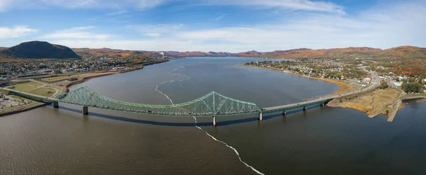 Aerial panoramic view of J.C. Van Horne Bridge that runs from Pointe--la-Croix, Quebec, to Campbellton, New Brunswick, Canada.
