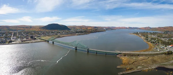 Aerial panoramic view of J.C. Van Horne Bridge that runs from Pointe--la-Croix, Quebec, to Campbellton, New Brunswick, Canada.