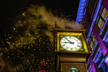 Steam Clock during a dark winter night in Gastown, Downtown Vancouver, BC, Canada. clipart