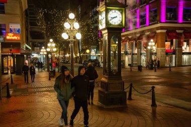 Downtown Vancouver, British Columbia, Canada - December 15, 2018: Street view of Gastown during a winter night. clipart