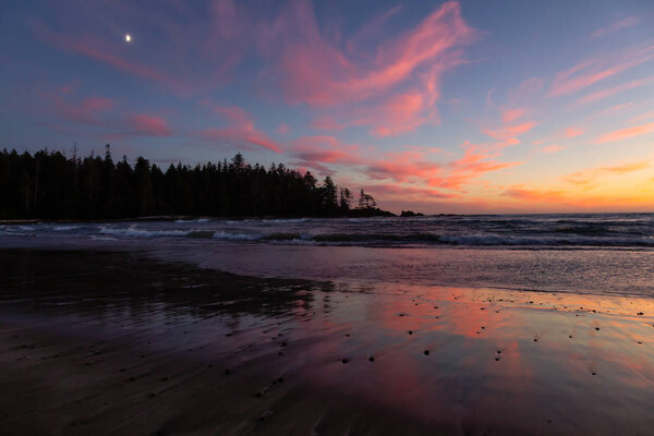 Beautiful sandy beach on the Pacific Ocean Coast during a vibrant summer sunset. Taken in Raft Cove Provincial Park, Northern Vancouver Island, BC, Canada.