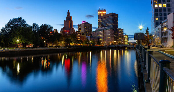 Providence, Rhode Island, United States - October 25, 2018: Scenic view of a beautiful modern downtown city during a colorful night after sunset.