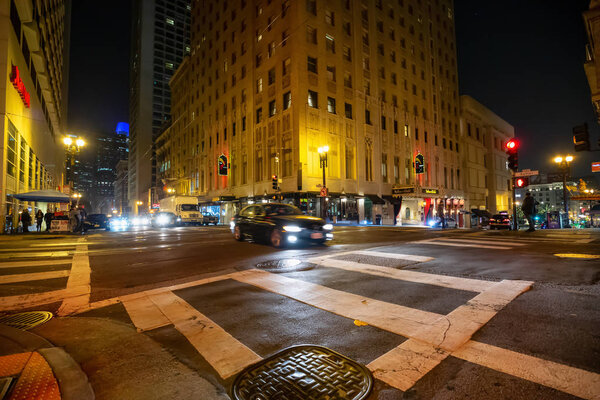 San Fancisco, California, United States - November 16, 2018: Urban streets in the downtown city during night time.