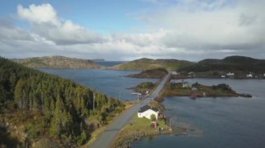 Aerial view of a small town on a rocky Atlantic Ocean Coast during a cloudy day. Taken in Herring Neck, Newfoundland, Canada.