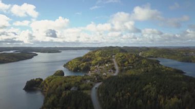 Aerial view of a small town on a rocky Atlantic Ocean Coast during a cloudy day. Taken in Herring Neck, Newfoundland, Canada.
