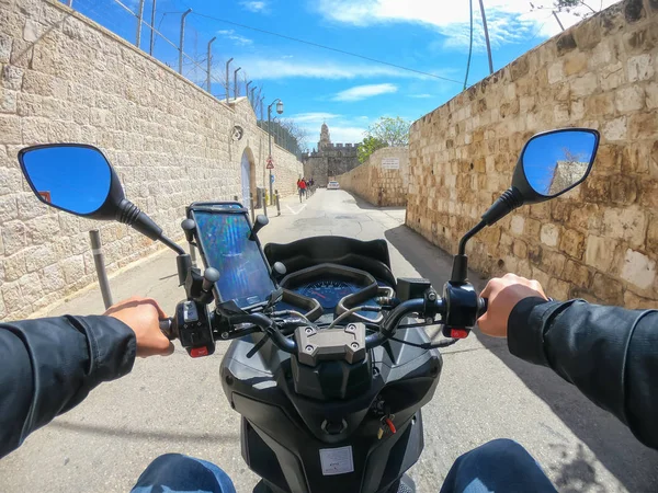 Stock image Jerusalem, Israel - April 16, 2019: Riding a scooter in the busy urban streets during a cloudy and sunny day.