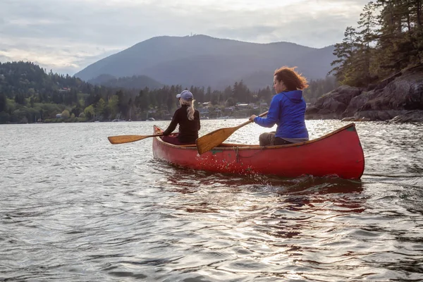 Couple Adventurous Female Friends Red Canoe Paddling Howe Sound Cloudy Stock Image