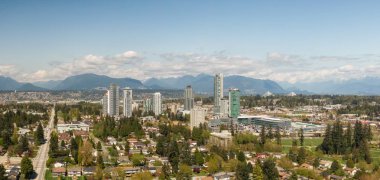 Panoramic view of residential neighborhood in the city during a sunny day. Taken in Greater Vancouver, British Columbia, Canada. clipart