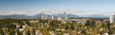Panoramic view of residential neighborhood in the city during a sunny day. Taken in Greater Vancouver, British Columbia, Canada. clipart