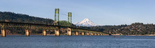 Beautiful Panoramic View of Hood River Bridge going over Columbia River with Mt Hood in the background. Taken in White Salmon, Washington, USA.