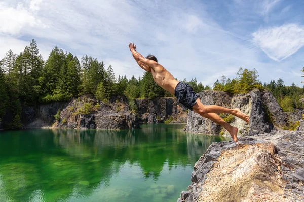 Athletic Adventurous Man Cliff Jumping Green Colored Glacier Lake Hot — Stock Photo, Image