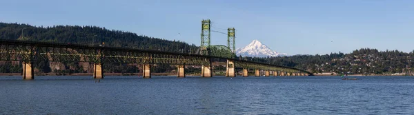 Beautiful Panoramic View of Hood River Bridge going over Columbia River with Mt Hood in the background. Taken in White Salmon, Washington, USA.