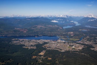 Aerial view of a small town, Port Alberni, on Vancouver Island during a sunny summer morning. Located in British Columbia, Canada. clipart