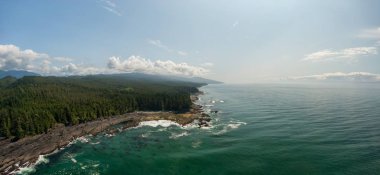 Beautiful Aerial Panoramic Landscape View of the Rocky Pacific Ocean Coast in the Southern Vancouver Island during a sunny summer day. Taken between Victorial and Port Renfrew, BC, Canada. clipart