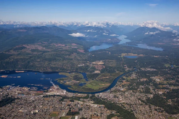 Aerial view of a small town, Port Alberni, on Vancouver Island during a sunny summer morning. Located in British Columbia, Canada.