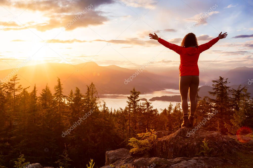 Adventure Girl on top of a Mountain with Canadian Nature Landscape